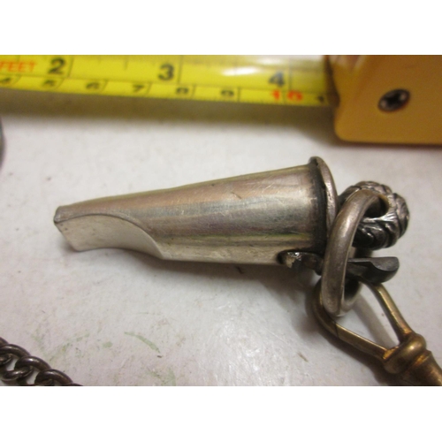 61 - Interesting silver plated Victorian whistle in container with lanyard, metal chain