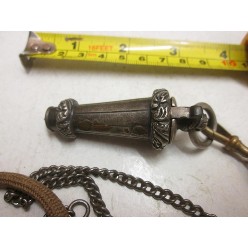 61 - Interesting silver plated Victorian whistle in container with lanyard, metal chain