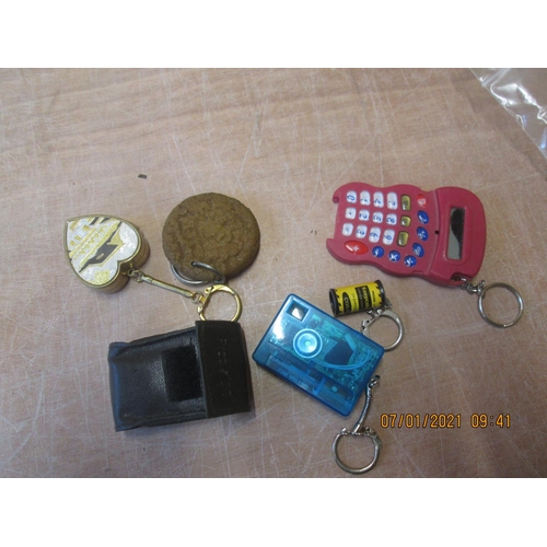 49 - Novelty keyrings : camera, music box etc.