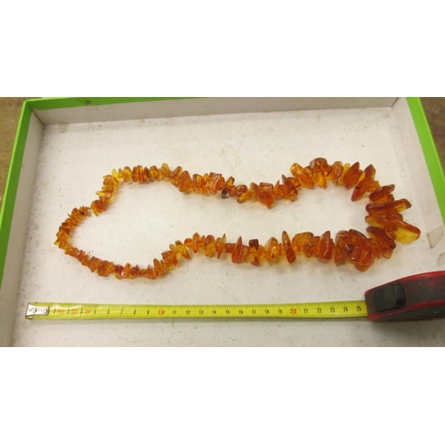 73 - Chipped amber necklace 100 g