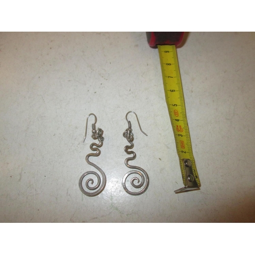 114 - Pair of modern silver earrings