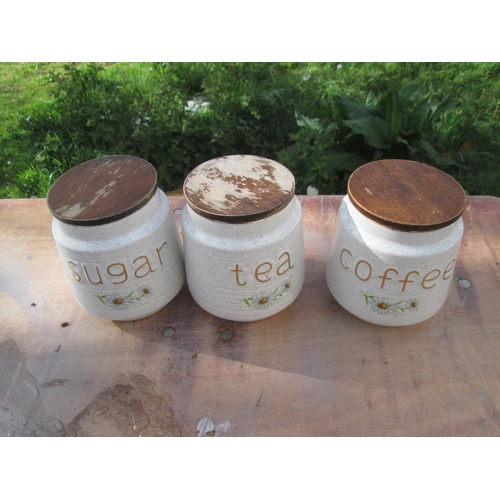 35 - 3 Kernewek Goonhavern Pottery daisy pattern storage jars, lids worn and seals deteriorated