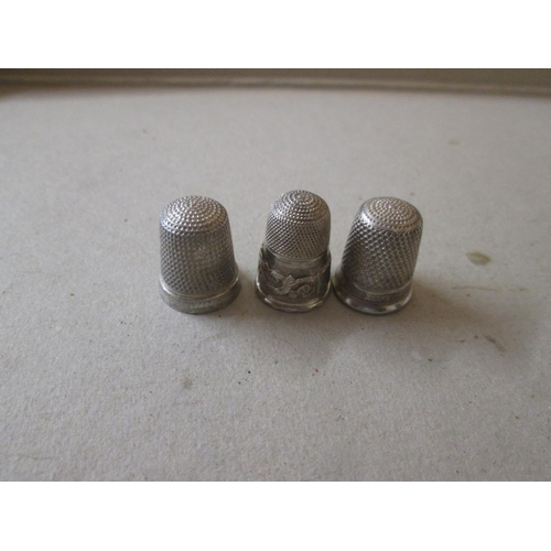 41 - 2 x English silver thimbles & one other white metal thimble