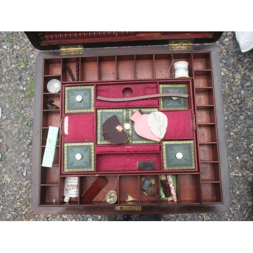 86 - Victorian rosewood sewing table, with hinged lid, fitted interior, note some damage but some pieces ... 