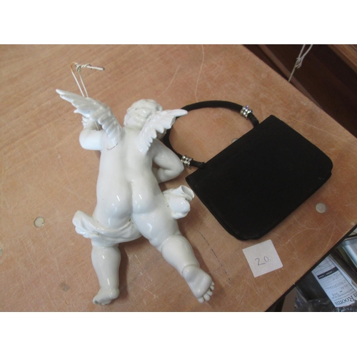 193 - Evening bag and cherub wall lamp (damaged)