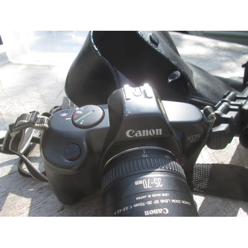 273 - Canon EOS 850 with a 35 -70 zoom lens in leather case with accessories including tripods instruction... 