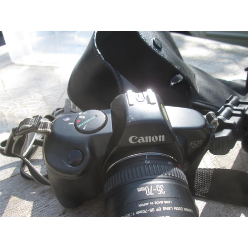 273 - Canon EOS 850 with a 35 -70 zoom lens in leather case with accessories including tripods instruction... 