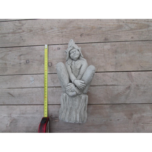 336 - Composite stone garden ornament : Seated Pixie