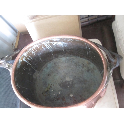 499 - 19th century large copper cooking pot with lid and wrought iron swing handle 55 cms x 50 cms