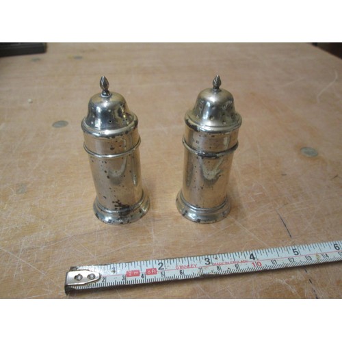 529 - Pair of silver pepper pots, marks rubbed Birm. 1919 63 g