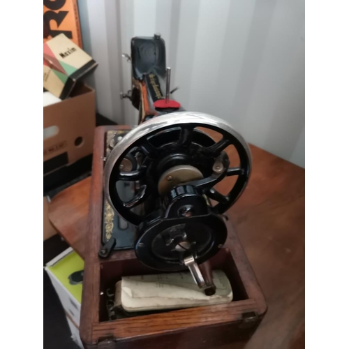 562 - Singer sewing machine in dome case Model 99