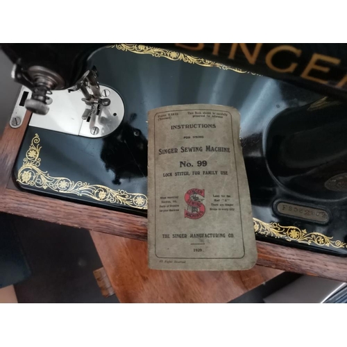 562 - Singer sewing machine in dome case Model 99