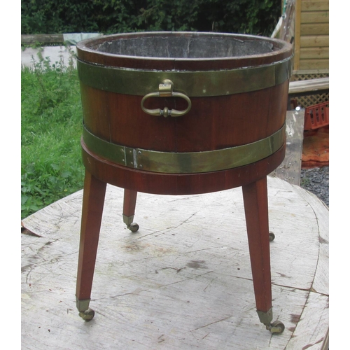 92 - Georgian mahogany wine cooler, with lift off top with partial lead lining on oval base with square t... 