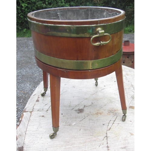 92 - Georgian mahogany wine cooler, with lift off top with partial lead lining on oval base with square t... 