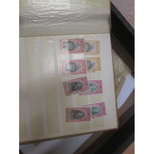 4 - A quantity of stamp duplicates in a small stock book, higher value stamps from 1954 Rhodesia & Nyasa... 