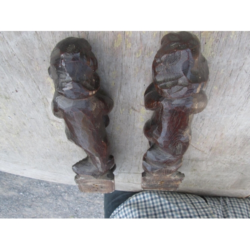 211 - Pair of late 17th / early 18th century carved oak cherub finials, probably from a church screen 30 c... 