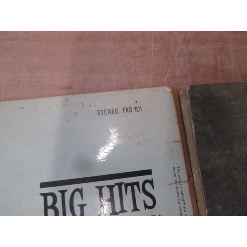 116 - 2 x Rolling Stones records : Big Hits, sleeves damaged, deeper scratches and scuffing