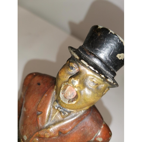 281 - Scarce early 20th century cast spelter cold painted cigar cutter modelled as a Town Crier, arm drop ... 