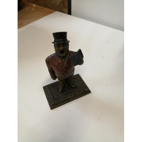 281 - Scarce early 20th century cast spelter cold painted cigar cutter modelled as a Town Crier, arm drop ... 