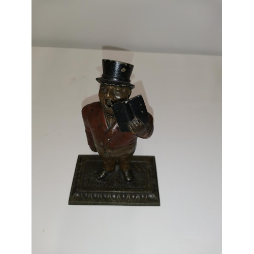 281 - Scarce early 20th century cast spelter cold painted cigar cutter modelled as a Town Crier, arm drop ... 