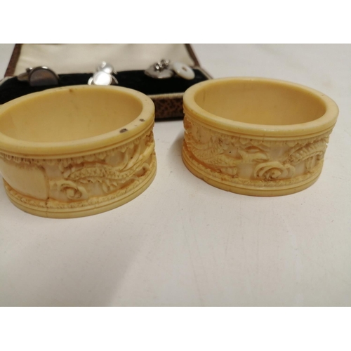 101 - Pair of late 19th century carved Chinese ivory serviette rings & vintage cufflinks in case