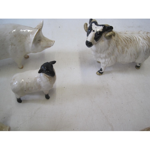 425 - Assorted pieces of Beswick pigs & sheep and studio pottery