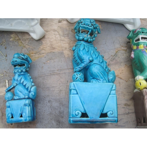 440 - Various Chinese ceramic Foo Dog ornaments, note some damages