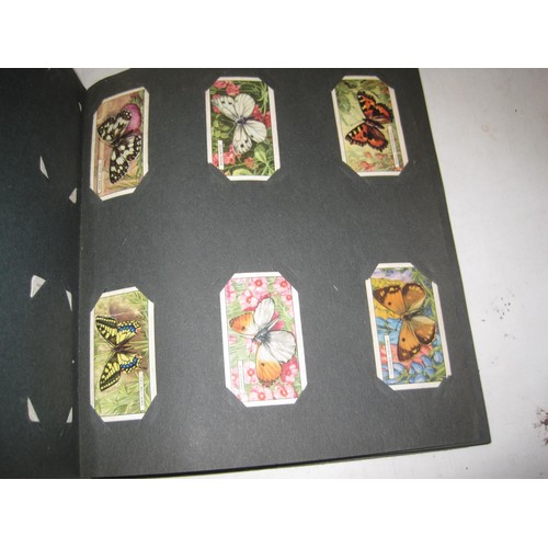 493 - Assorted albums of Commemorative issue cigarette cards by major manufacturers fixed in albums, loose... 