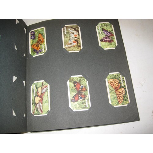 493 - Assorted albums of Commemorative issue cigarette cards by major manufacturers fixed in albums, loose... 