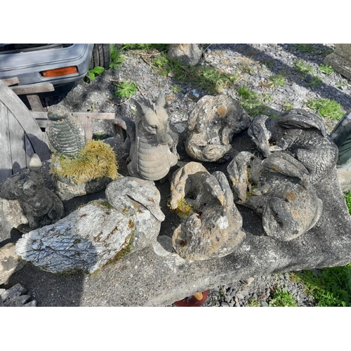 563 - Menagerie of composite stone garden ornaments