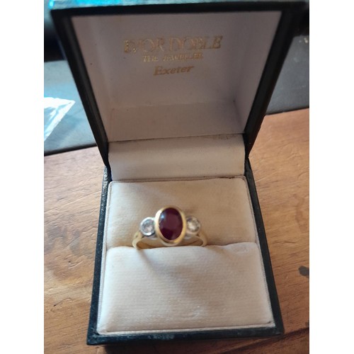 521 - 18 ct gold ring set with two diamonds and  garnet size N, 4.4 g