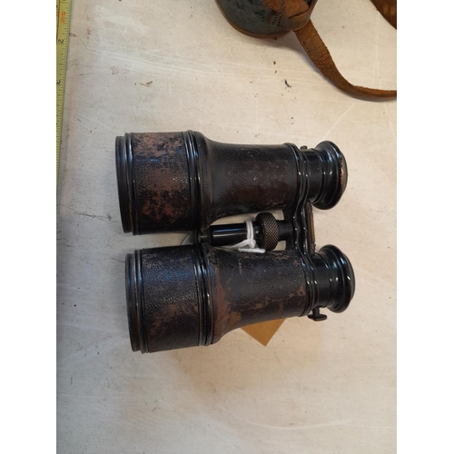 350 - Pair of early 20th century Negretti and Zambra binoculars in damaged leather case