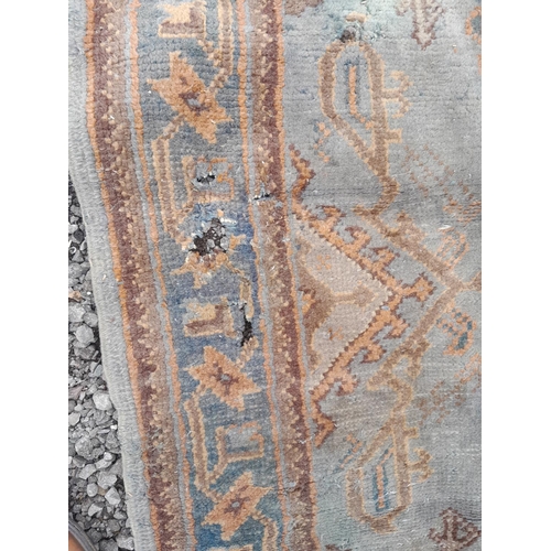 396 - Early 20th century light blue ground hand woven Persian rug