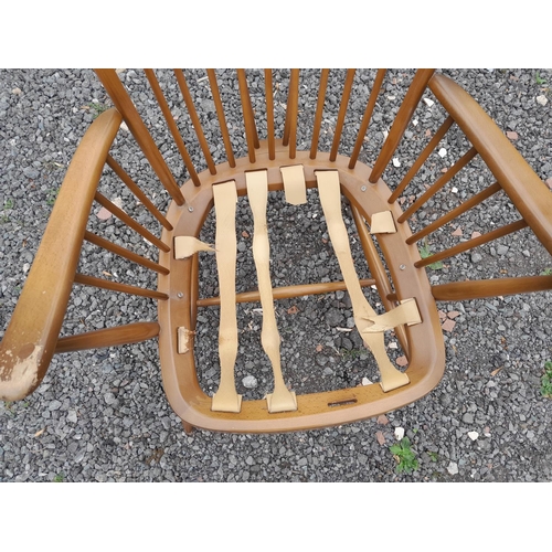 3 - Vintage Ercol stick back easy chair in need of restoration, worn on arms, sticks are strong, webbing... 