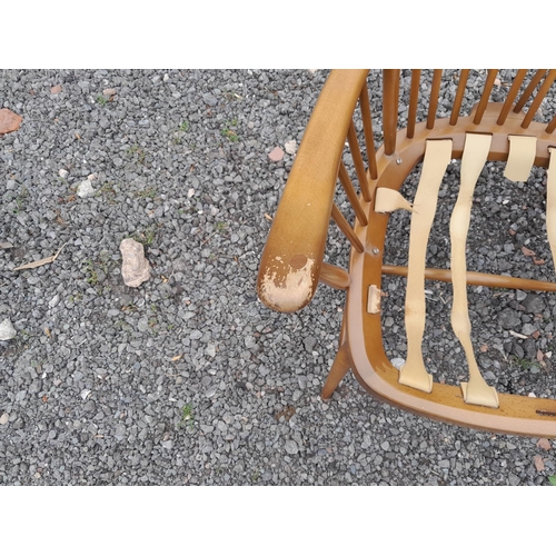 3 - Vintage Ercol stick back easy chair in need of restoration, worn on arms, sticks are strong, webbing... 