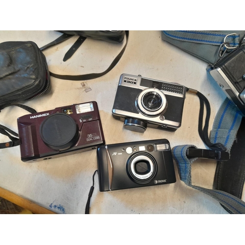 40 - Assorted cameras : Praktica MTL 50 with Zeiss macro lens & padded case, Zenit in leather case, Helio... 