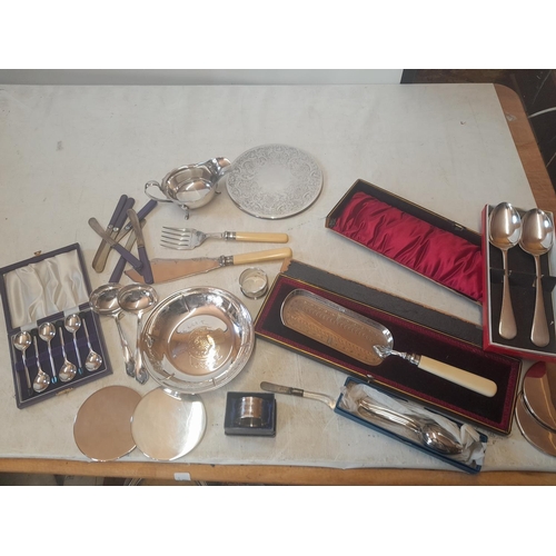 79 - Box of assorted silver plates ware, coaster, servers, cutlery etc.