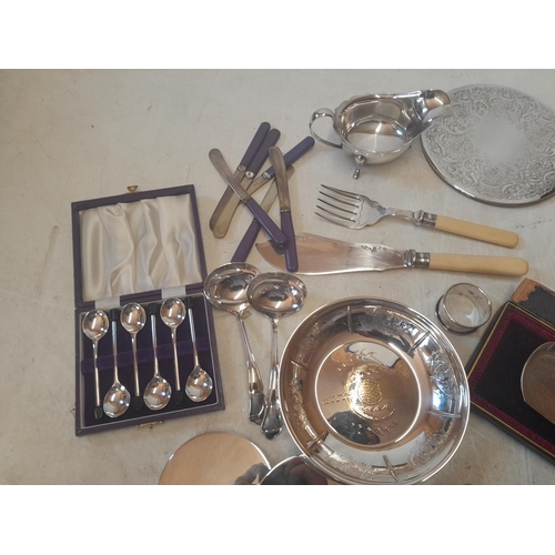 79 - Box of assorted silver plates ware, coaster, servers, cutlery etc.