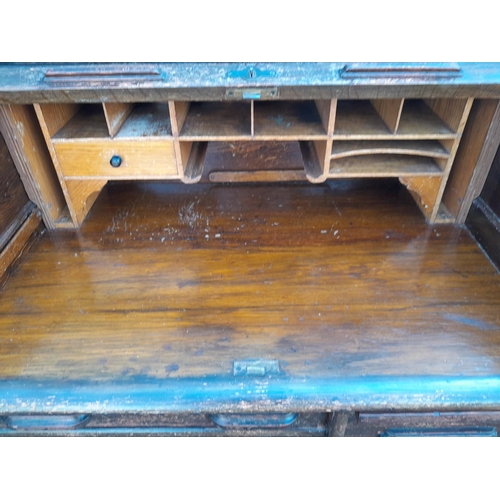 11 - Early 20th century oak single pedestal tabour top desk with fitted interior with key, single piece