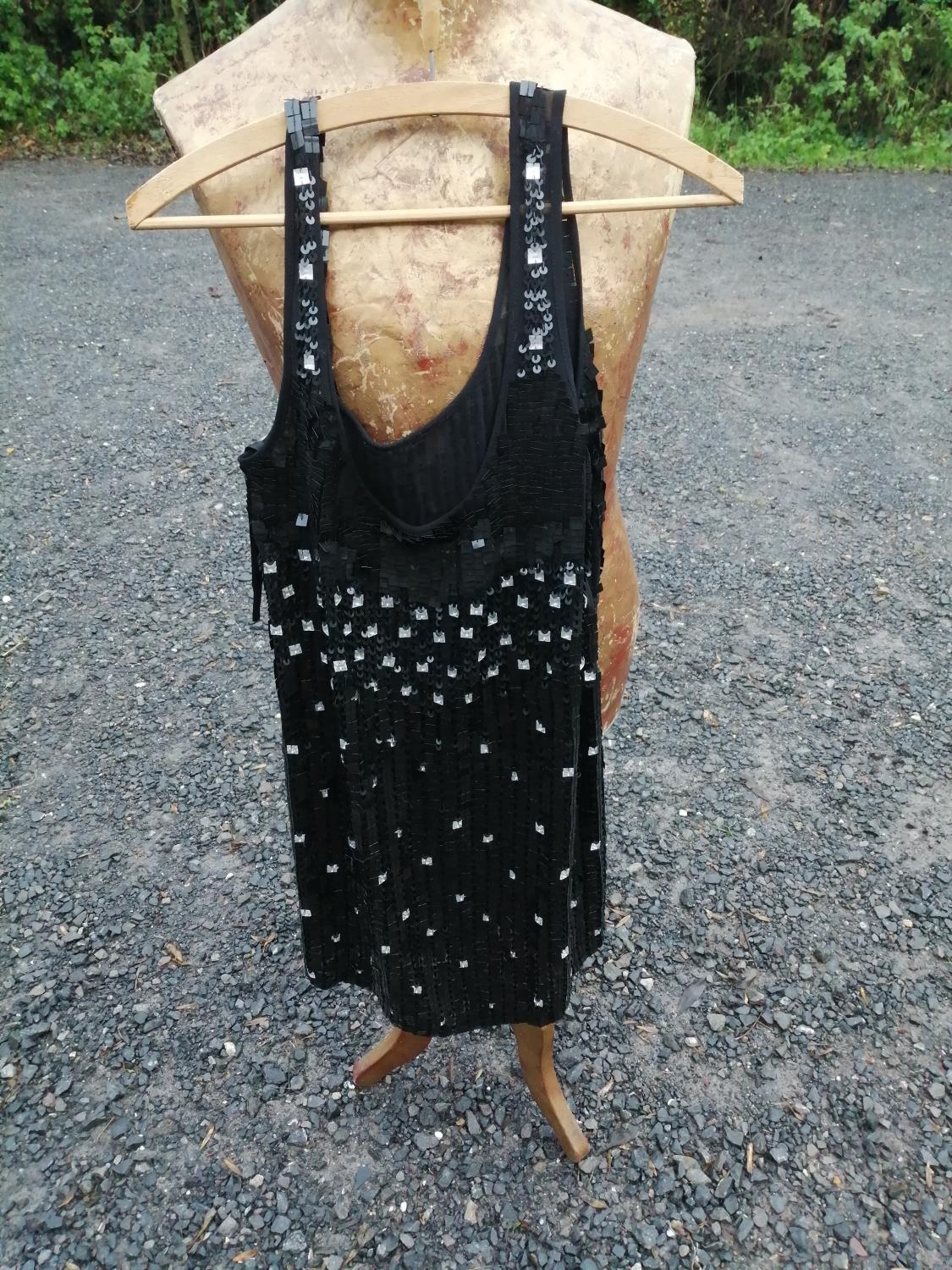 Textiles 1920s style flapper dress, decorated with square sequins