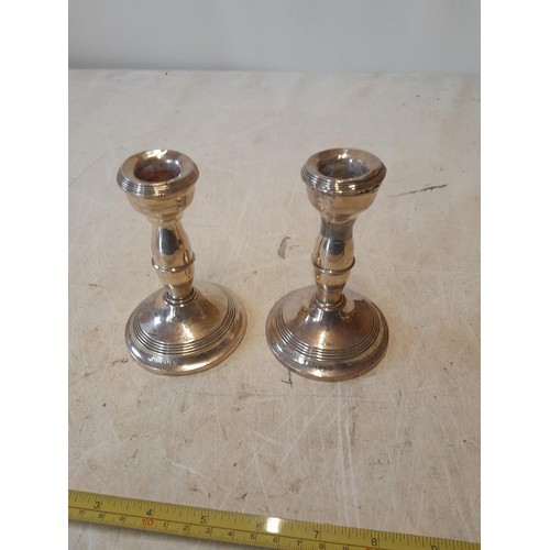 419 - Pair of silver candlesticks Birm. 1909 Napper & Davenport, note restoration and dings