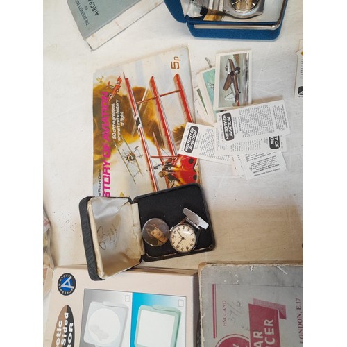 217 - Box of oddments : silver tea spoon, various vintage and modern wrisdtwatches, trade cards stamps as ... 