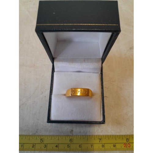 19 - Unmarked but test 9 ct gold ring with musical note engraving size U - V, 6.6 g