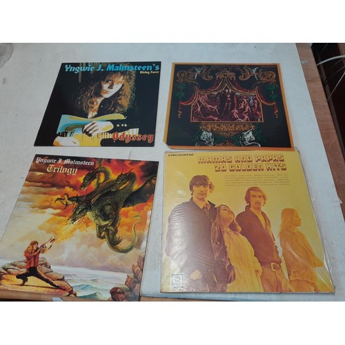 34 - 16 x vinyl record albums : Magnum, Magna Carta, Mahogany Rush (on import), Madam, Yngwie J Malmsteen