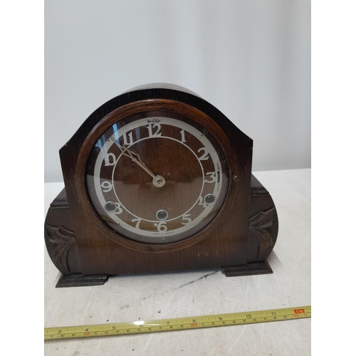 95 - Vintage oak case mantle clock with pendulum and key