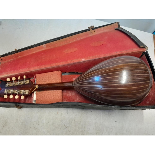 110 - Early 20th century bowl back mandolin  in case Francesco Perretti & Figli, in need of restoration