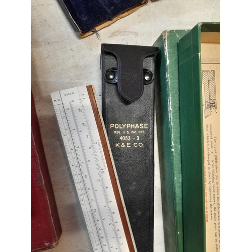 121 - 2 x slide rules, camera light meters etc.