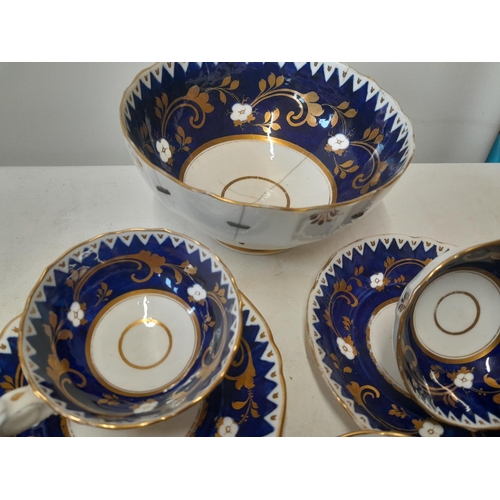 145 - Mid Victorian blue and gilt part tea set with some restoration and damages