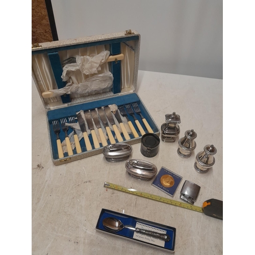 150 - Silver handled boxed tea spoon, table lighters, presentation case of fisheaters , bronze medal etc.