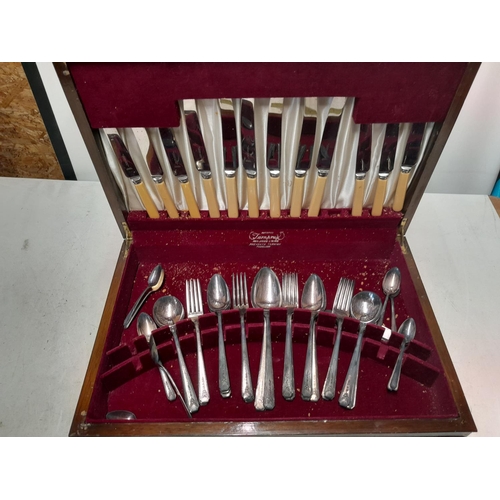 151 - Plated canteen of cutlery in walnut veneered box note damages